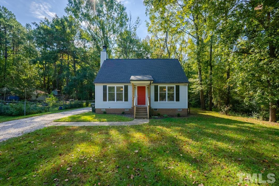 507 Valley Drive Durham, NC 27704 - Photo 29 of 29 a view of a house with a yard table and chairs