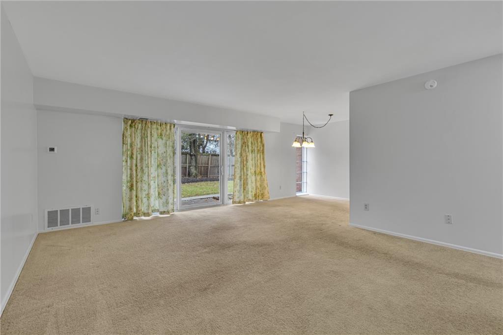 61 Darlington Road, Unit A18 Beaver Falls, PA 15010 - Photo 3 of 16 Living Room Towards Patio Doors