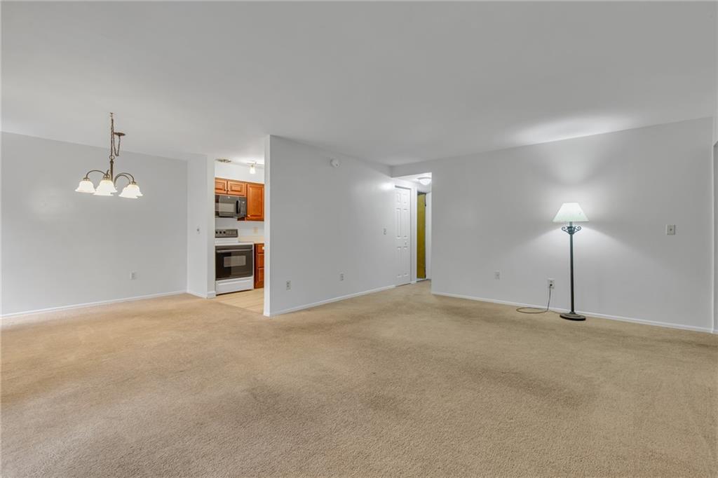 61 Darlington Road, Unit A18 Beaver Falls, PA 15010 - Photo 4 of 16 Living Room Towards Dining Room and Kitchen