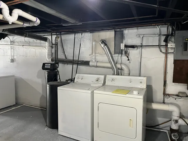 a view of storage and utility room with washer and dryer
