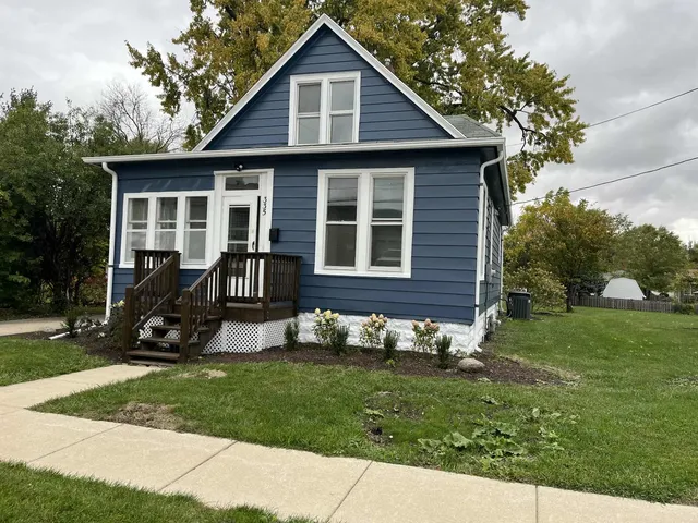 a view of a park with large trees