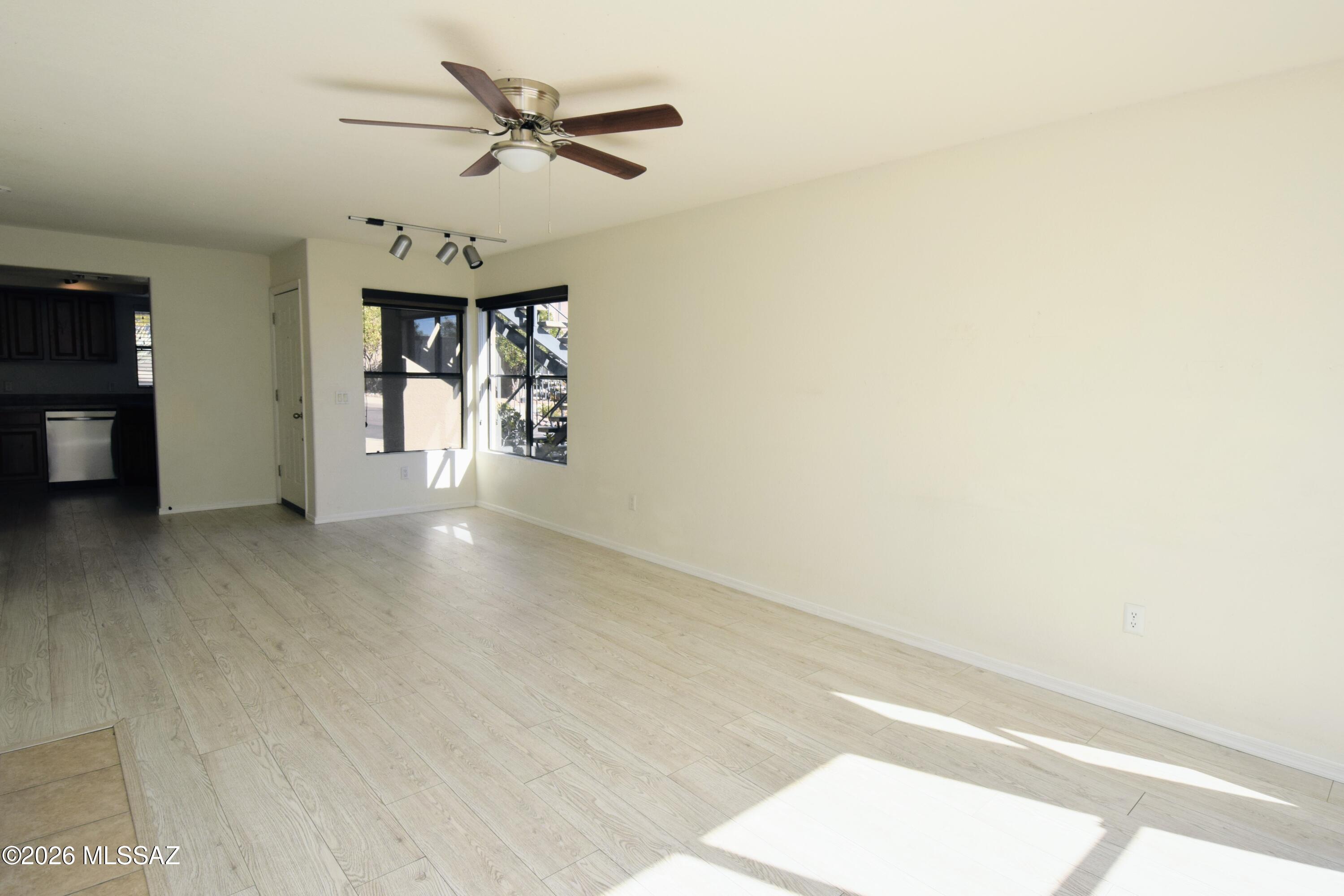 5855 North Kolb Road, Unit 11106 Tucson, AZ 85750 - Photo 10 of 36 a view of a livingroom with a ceiling fan and window