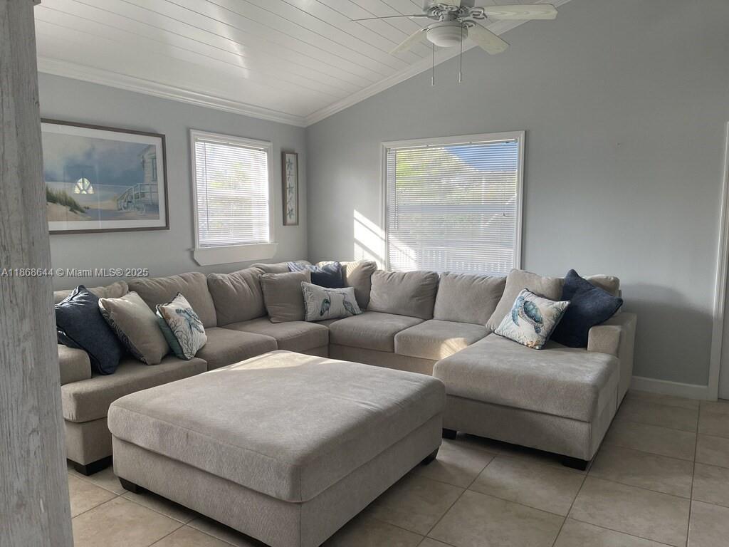1013 Snapper Lane Key Largo, FL 33037 - Photo 2 of 10 a living room with furniture and a window