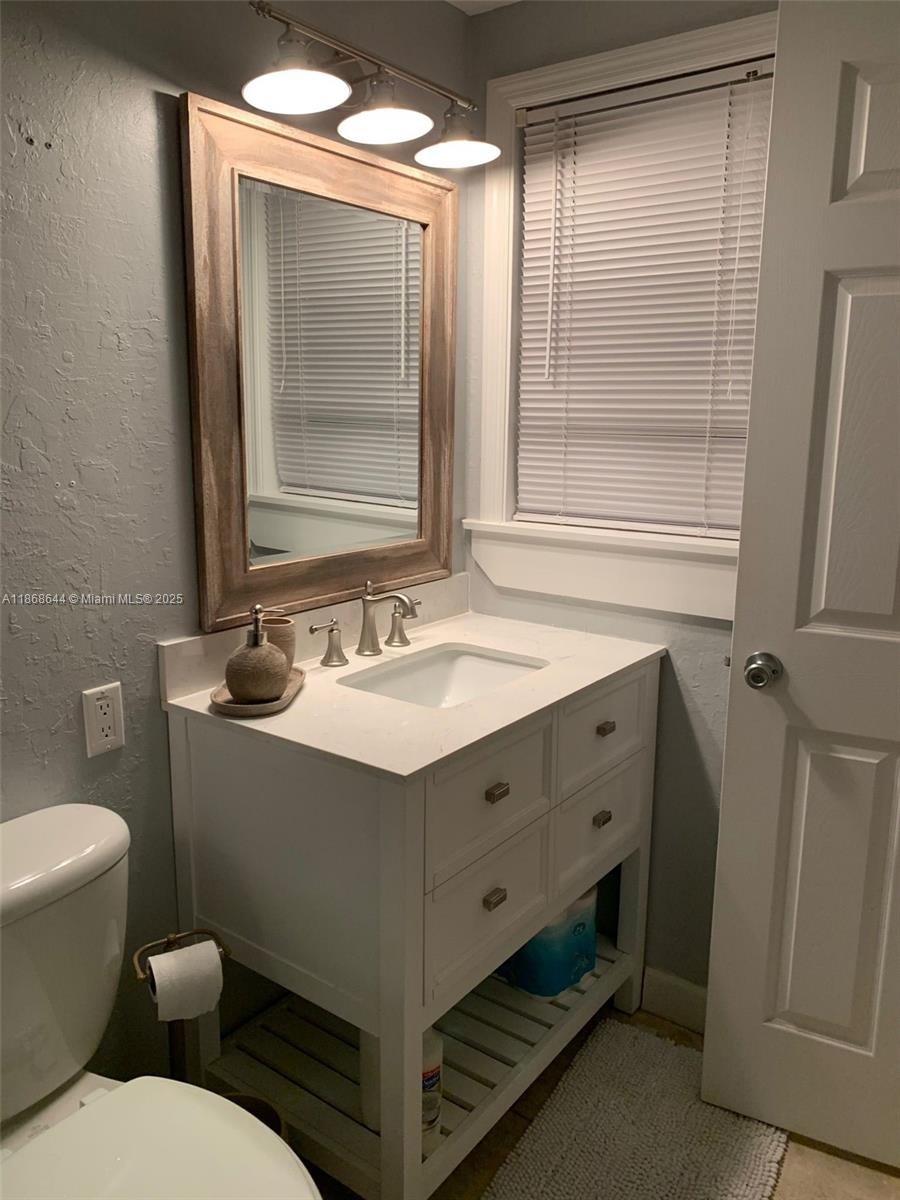 1013 Snapper Lane Key Largo, FL 33037 - Photo 10 of 10 a bathroom with a sink and a mirror