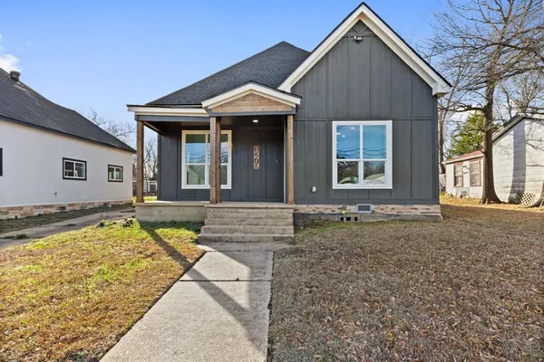 a view of a house with swimming pool and sitting area