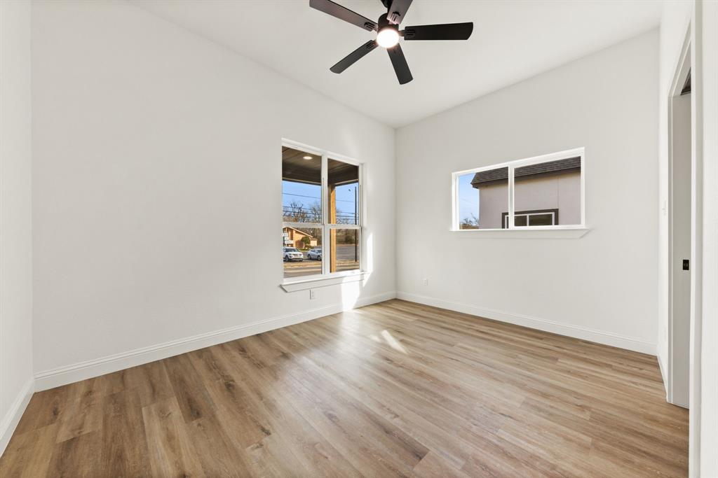 1279 Bonham Street Paris, TX 75460 - Photo 12 of 15 a view of empty room with wooden floor and fan