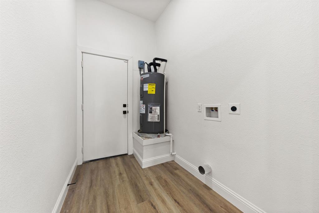 1279 Bonham Street Paris, TX 75460 - Photo 13 of 15 a view of an entryway with wooden floor