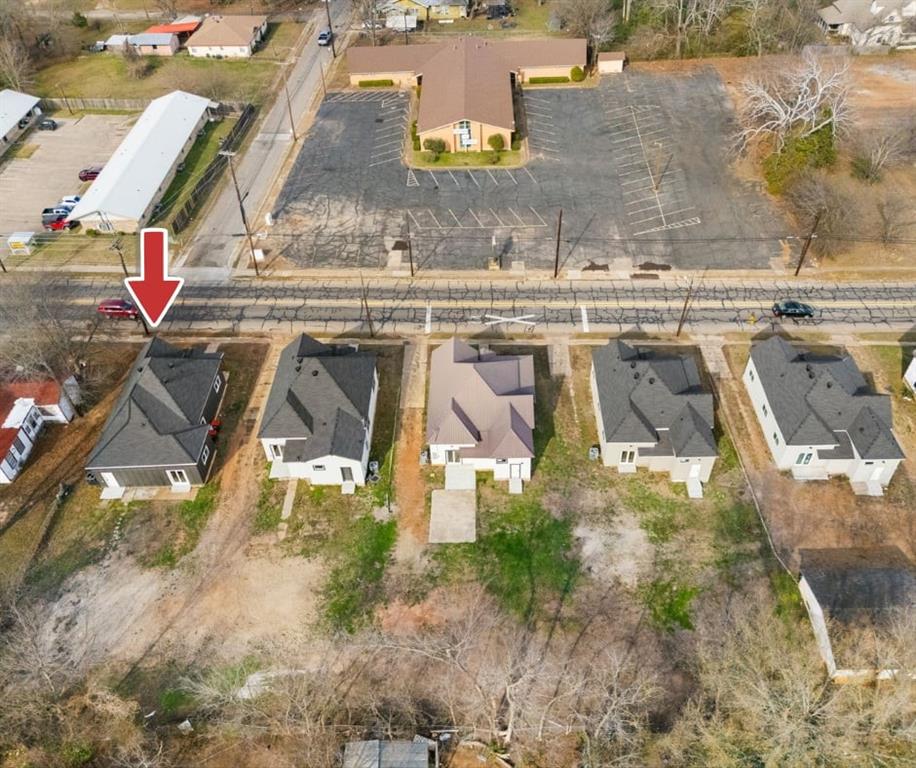 1279 Bonham Street Paris, TX 75460 - Photo 15 of 15 an aerial view of residential houses with outdoor space