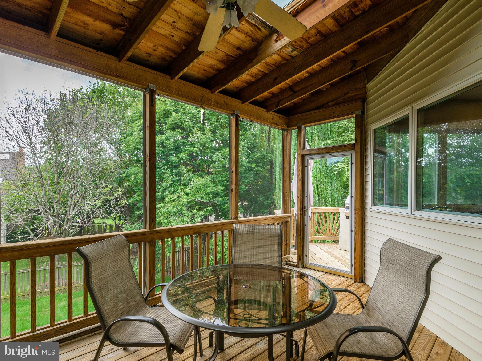 10889 Hunter Gate Way Reston, VA 20194 - Photo 3 of 30 a balcony with furniture and wooden floor