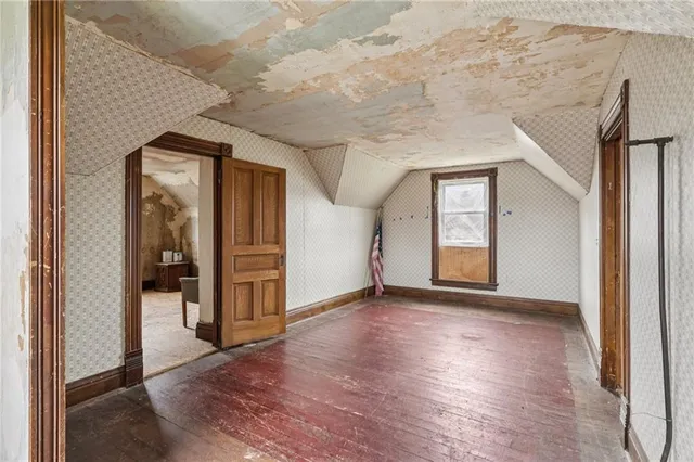 a living room with furniture a rug and a window