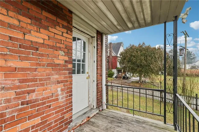a front view of a building with garden