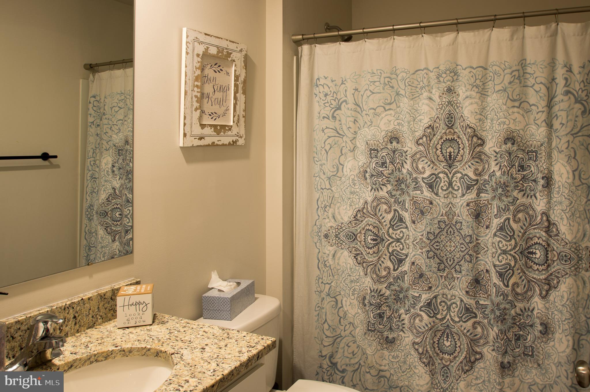 345 Maple Run Drive York, PA 17404 - Photo 24 of 26 a bathroom with a shower curtain and a sink