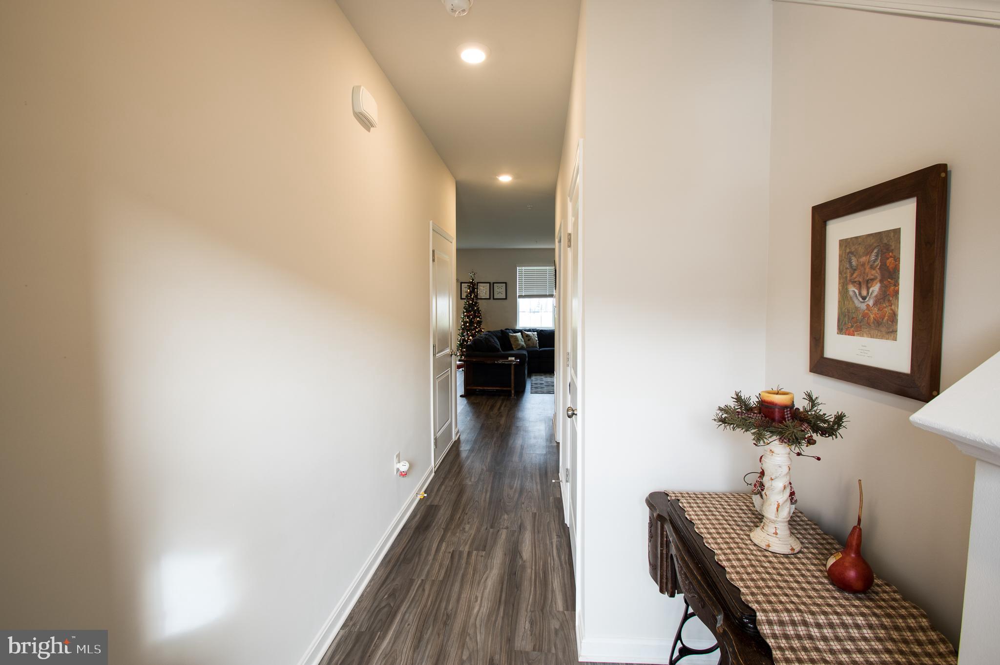 345 Maple Run Drive York, PA 17404 - Photo 7 of 26 a view of a hallway with furniture and wooden floor