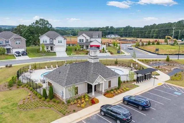 swimming pool view with a garden view