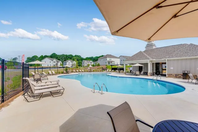 a view of a swimming pool with a porch