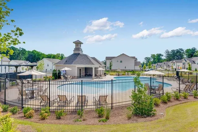 a view of a house with swimming pool