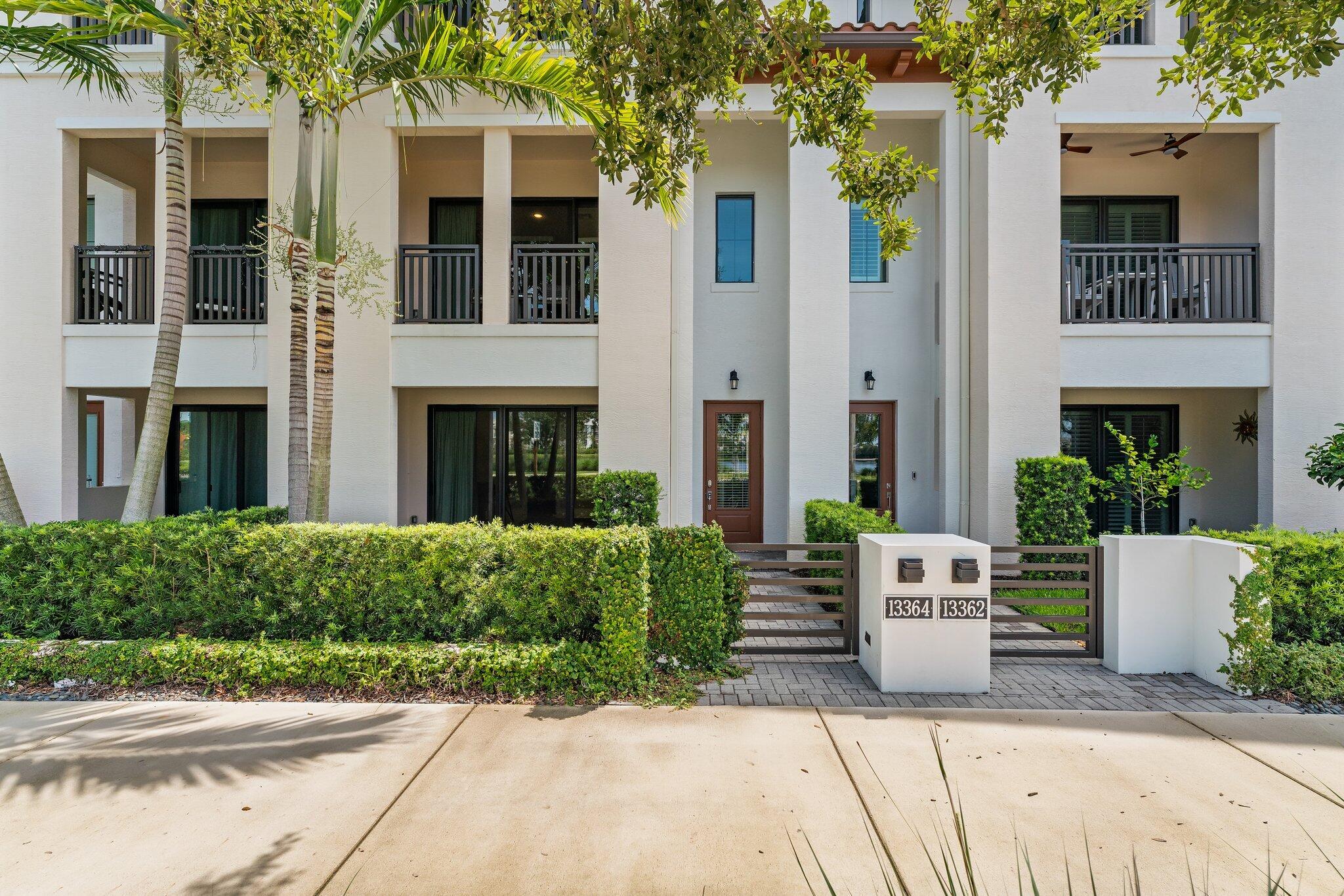 front view of a house with potted plants