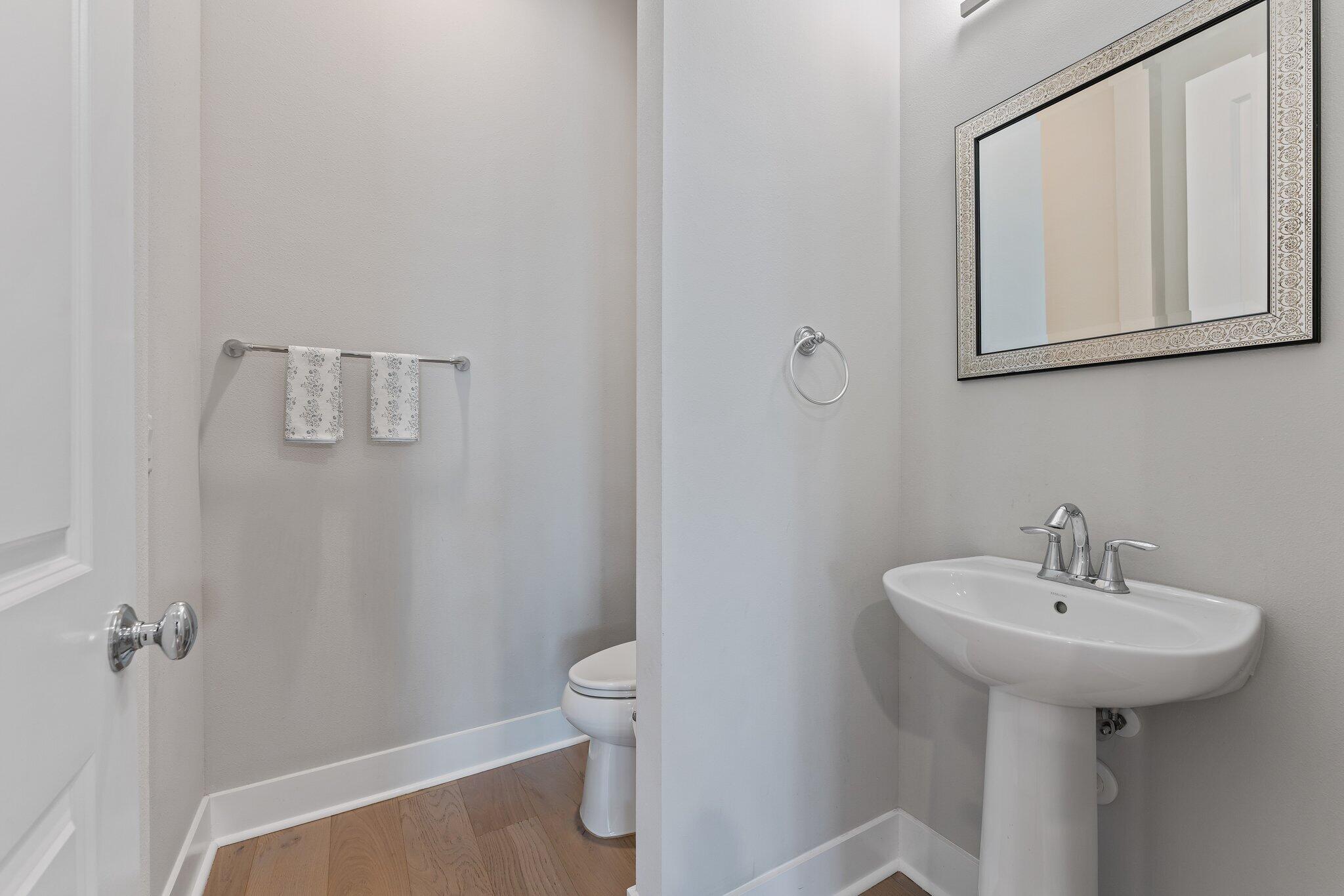 13364 Alton Road Palm Beach Gardens, FL 33418 - Photo 11 of 58 a bathroom with a sink toilet and mirror