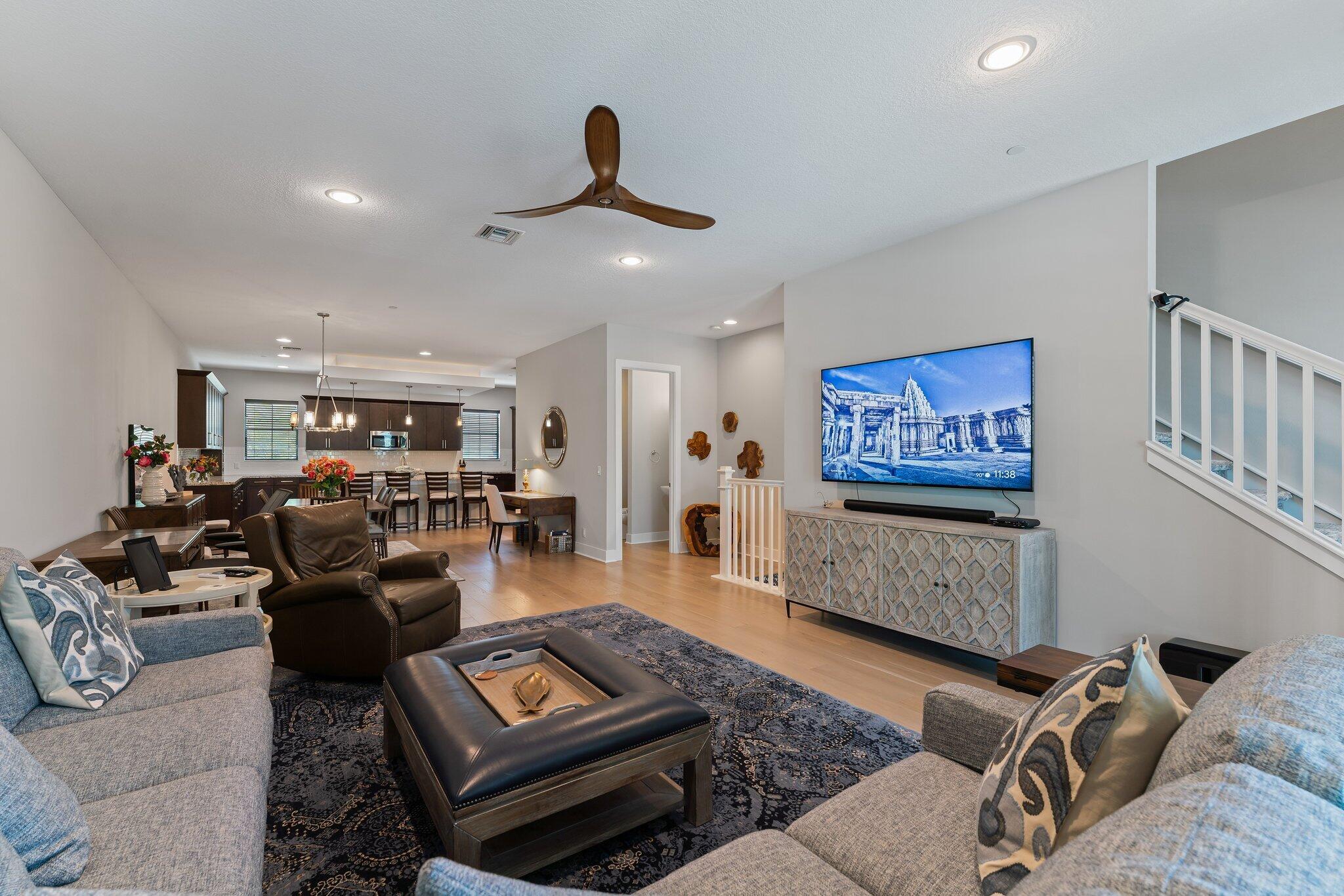 13364 Alton Road Palm Beach Gardens, FL 33418 - Photo 13 of 58 a living room with furniture and a flat screen tv