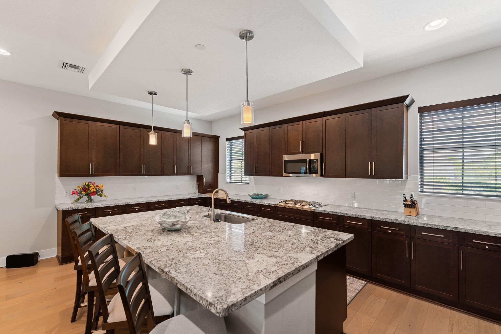 13364 Alton Road Palm Beach Gardens, FL 33418 - Photo 17 of 58 a kitchen with a counter space and a sink