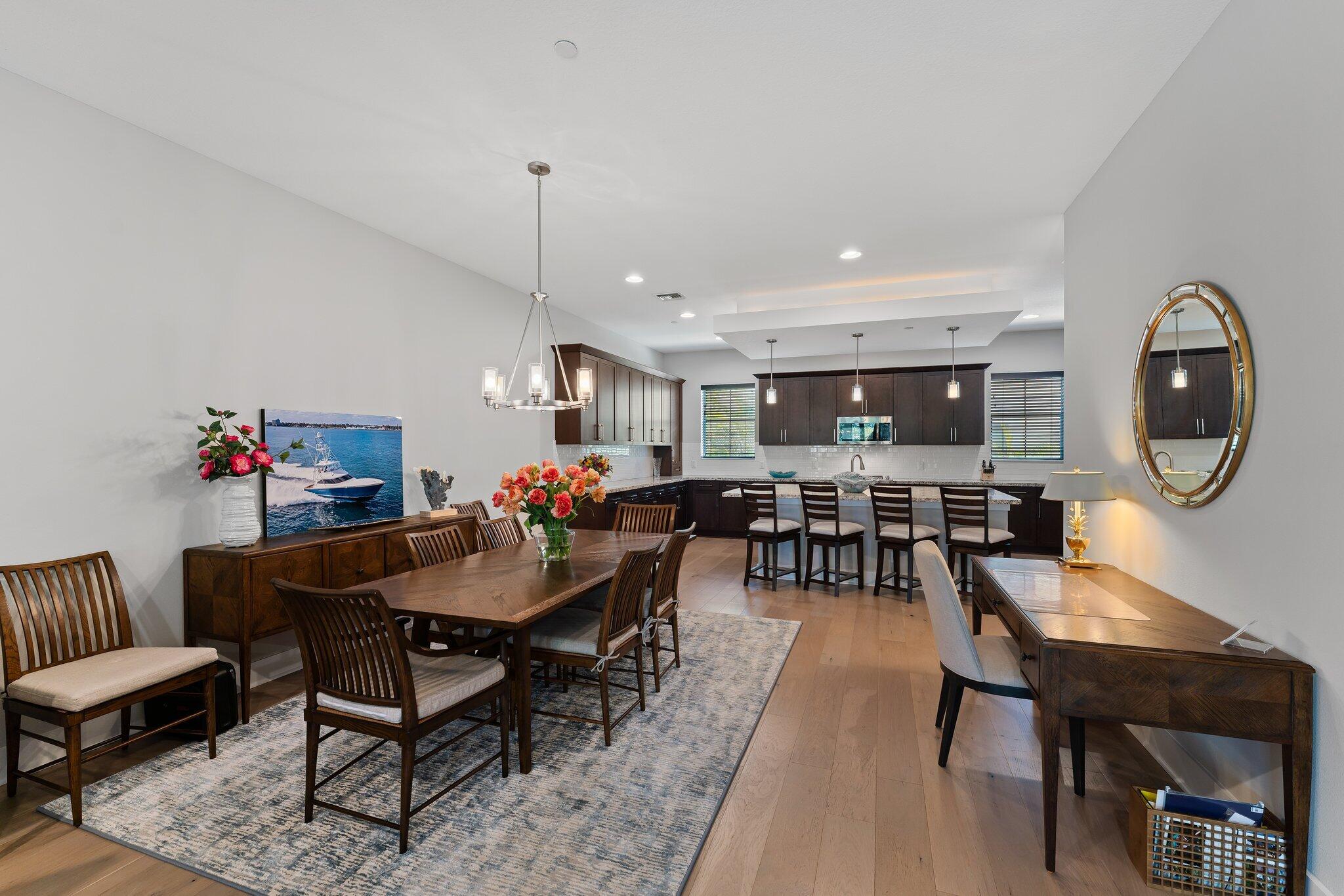 13364 Alton Road Palm Beach Gardens, FL 33418 - Photo 19 of 58 a view of a dining room with furniture and wooden floor