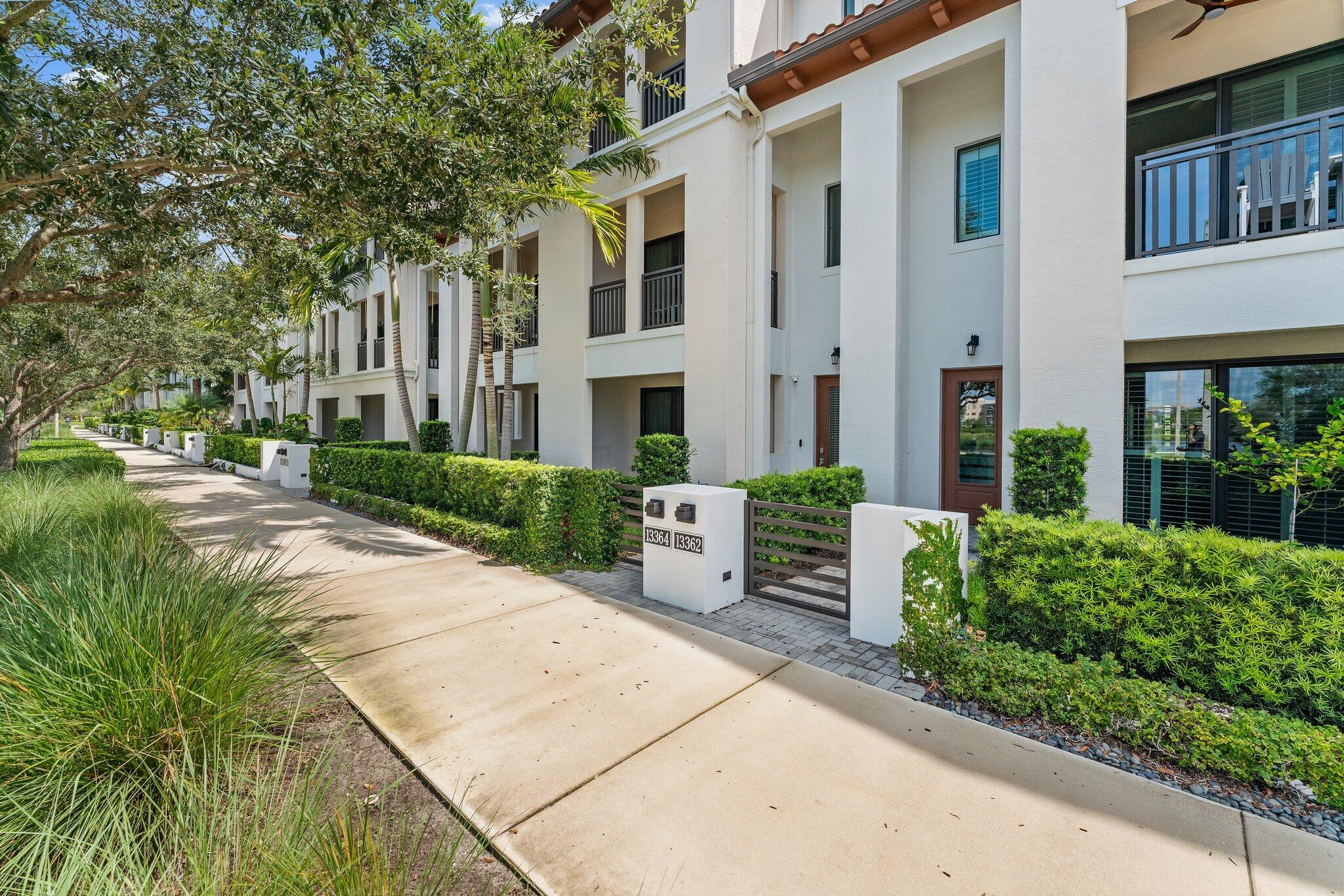 13364 Alton Road Palm Beach Gardens, FL 33418 - Photo 2 of 58 a view of a building with garden