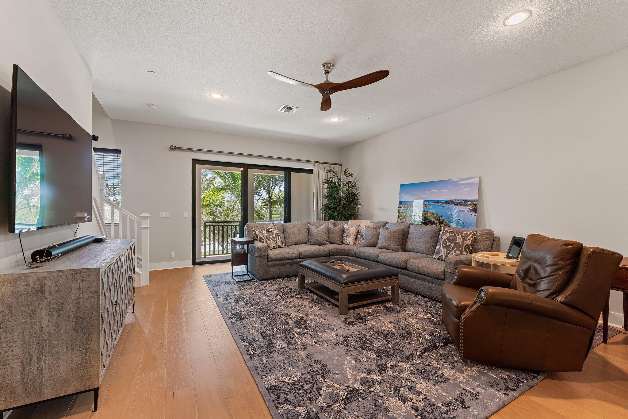 13364 Alton Road Palm Beach Gardens, FL 33418 - Photo 21 of 58 a living room with furniture and a flat screen tv
