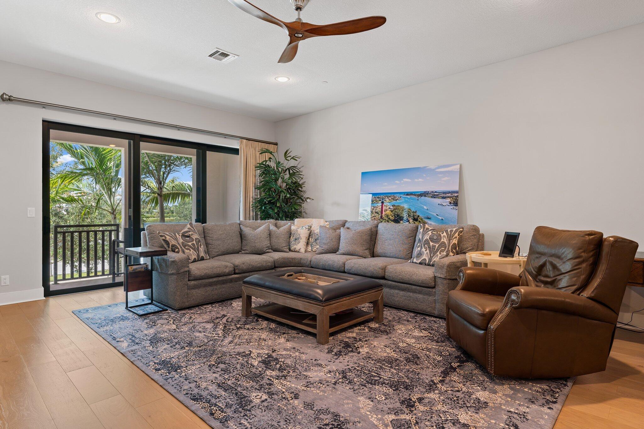 13364 Alton Road Palm Beach Gardens, FL 33418 - Photo 22 of 58 a living room with furniture and a large window