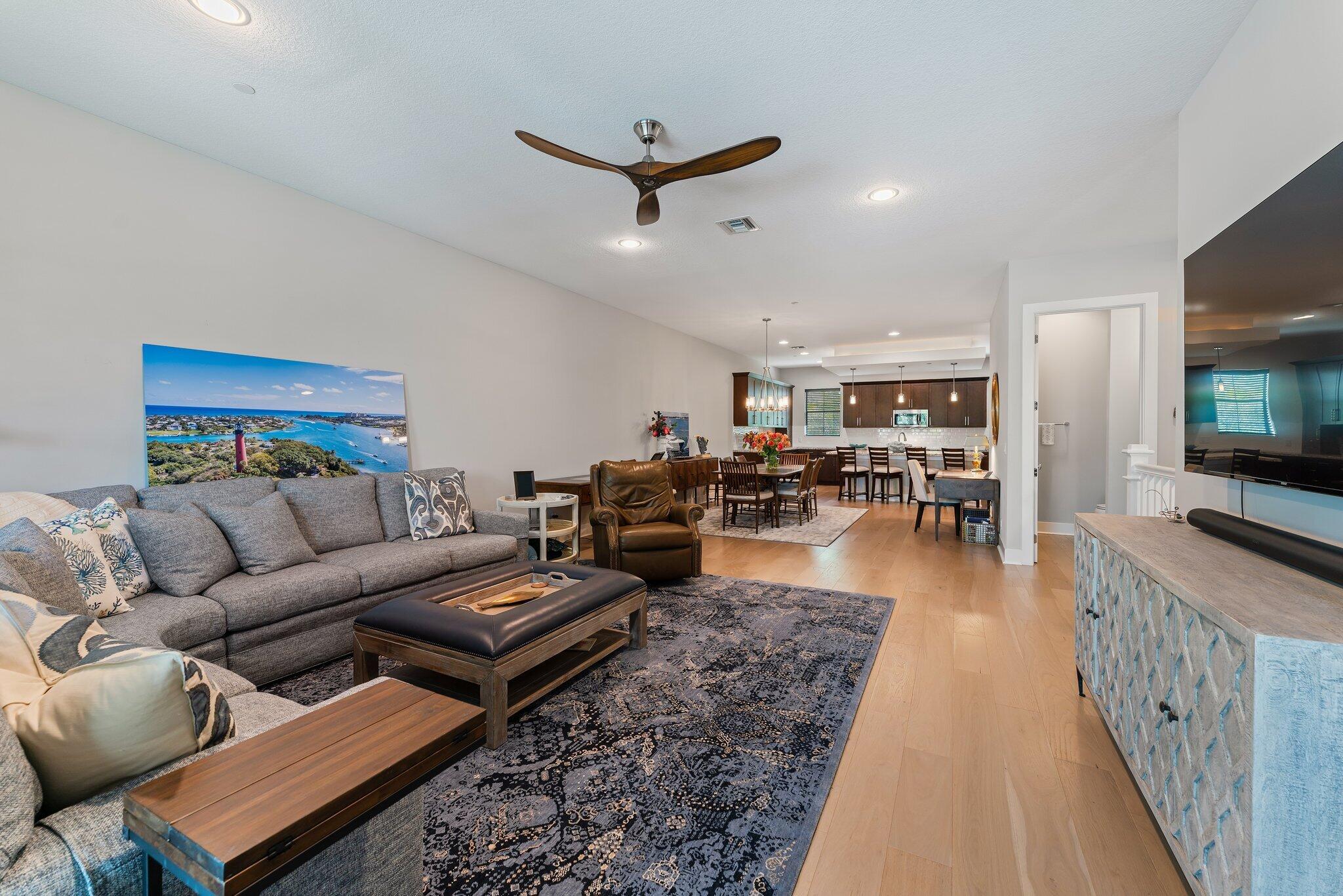 13364 Alton Road Palm Beach Gardens, FL 33418 - Photo 23 of 58 a living room with furniture and a flat screen tv