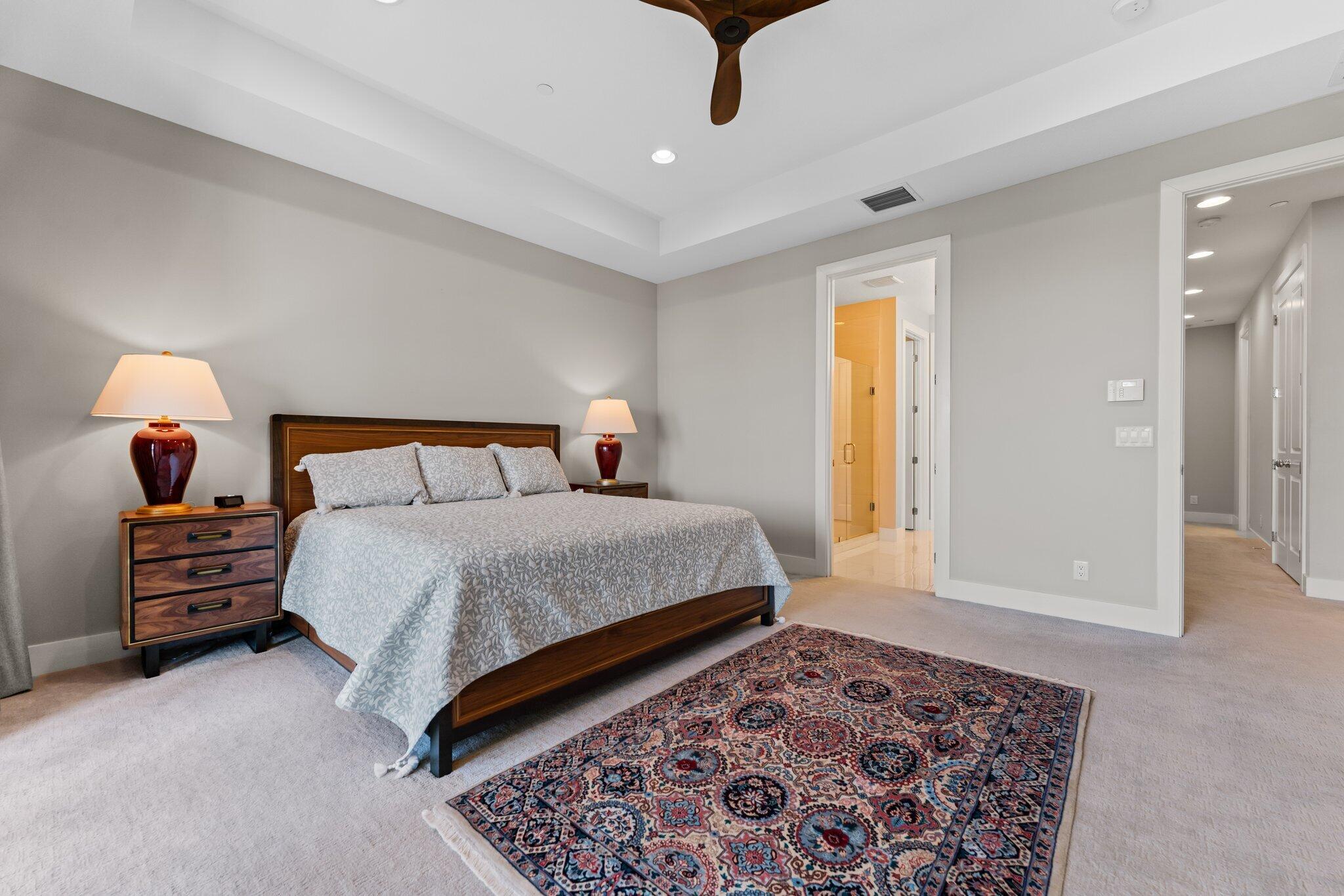 13364 Alton Road Palm Beach Gardens, FL 33418 - Photo 27 of 58 a bedroom with a bed and wooden floor