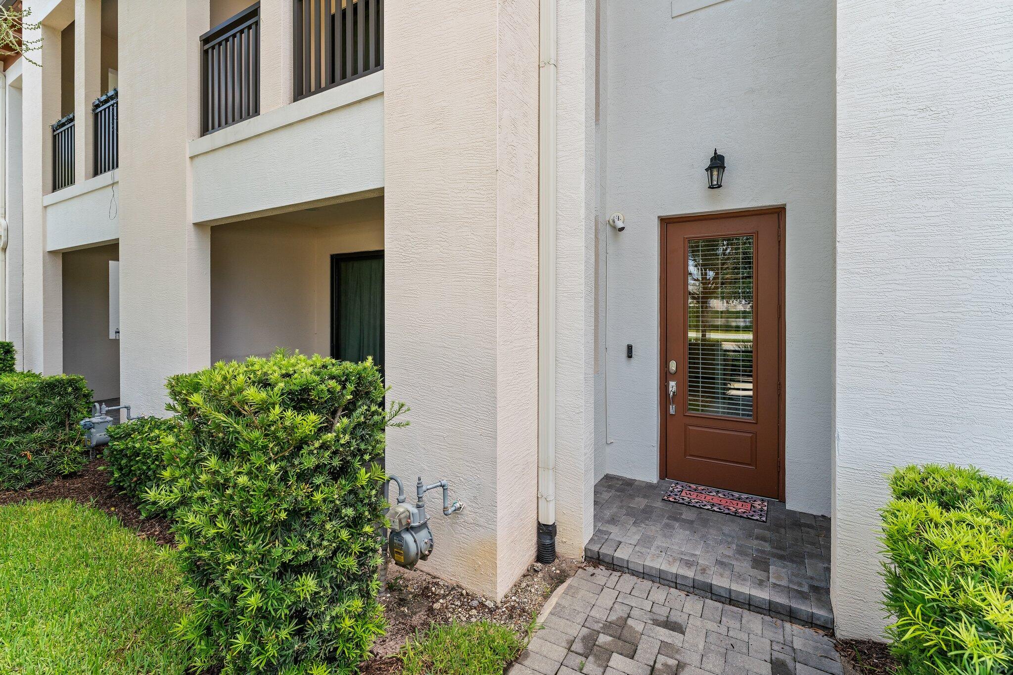 13364 Alton Road Palm Beach Gardens, FL 33418 - Photo 3 of 58 a view of a front door of the house