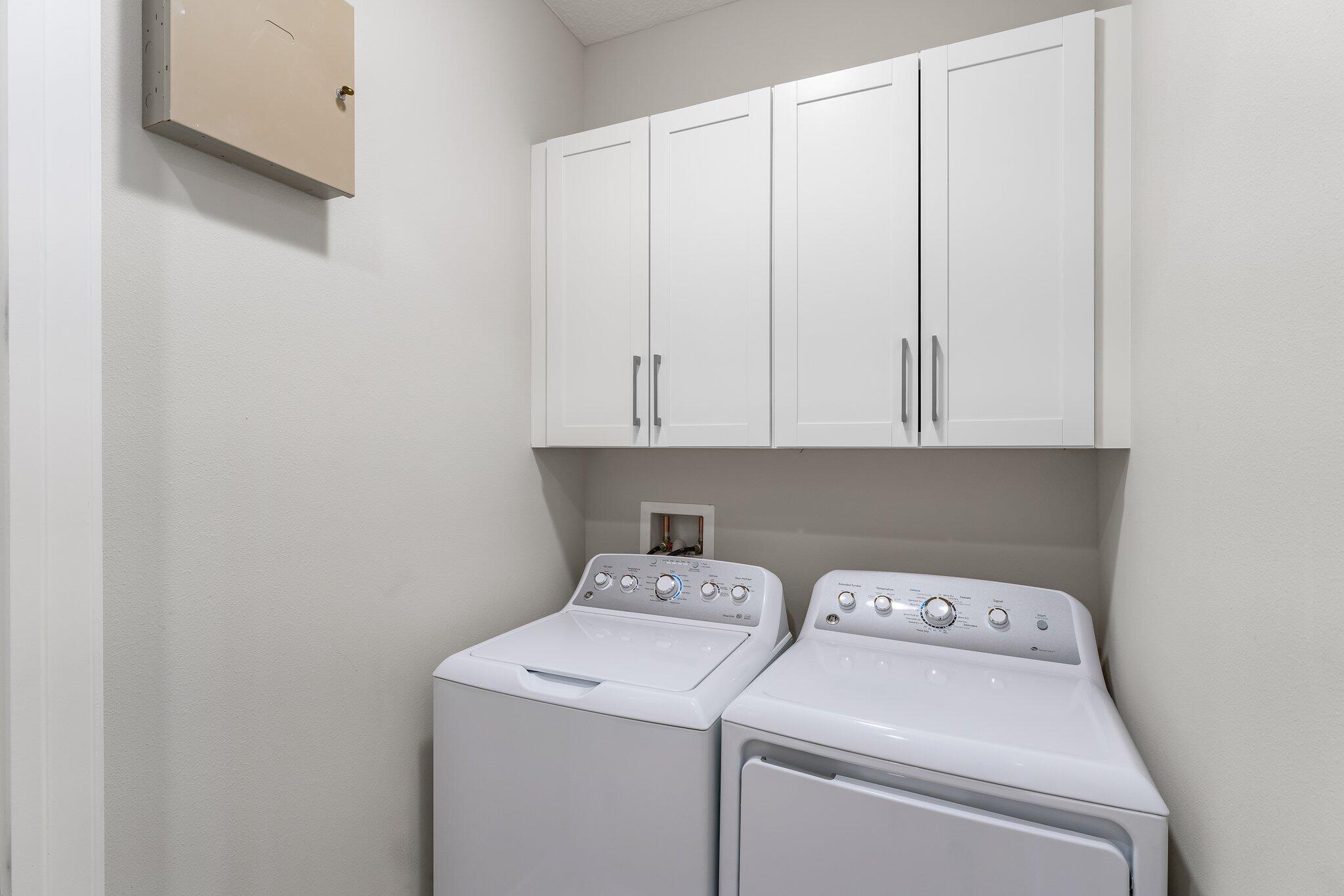 13364 Alton Road Palm Beach Gardens, FL 33418 - Photo 36 of 58 a view of storage and utility room with washer and dryer