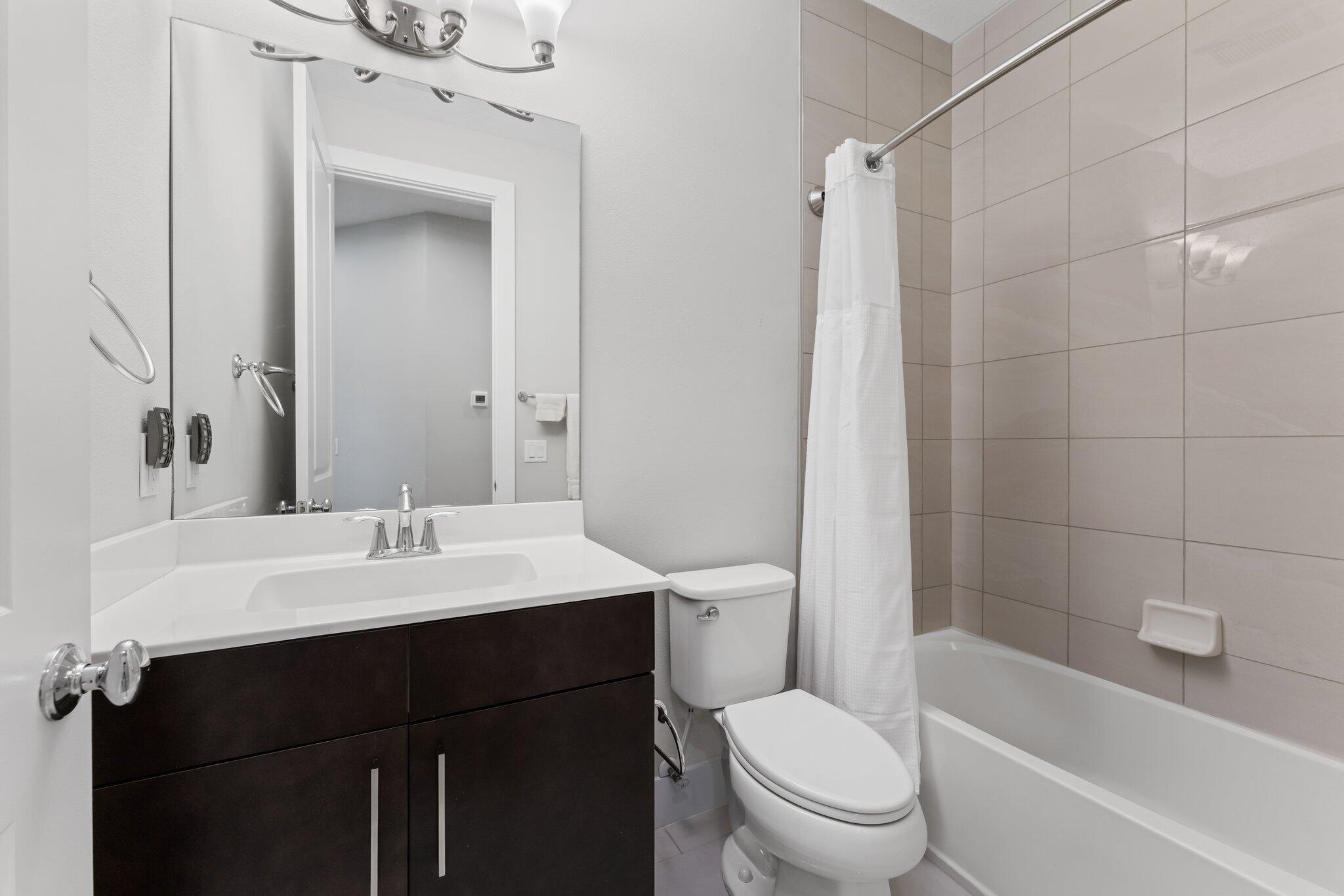 13364 Alton Road Palm Beach Gardens, FL 33418 - Photo 37 of 58 a bathroom with a sink a toilet and shower