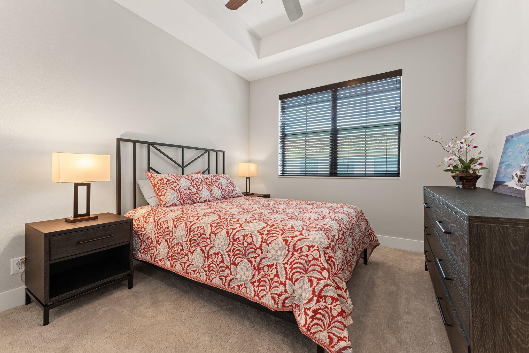 13364 Alton Road Palm Beach Gardens, FL 33418 - Photo 40 of 58 a bedroom with a bed and a dresser