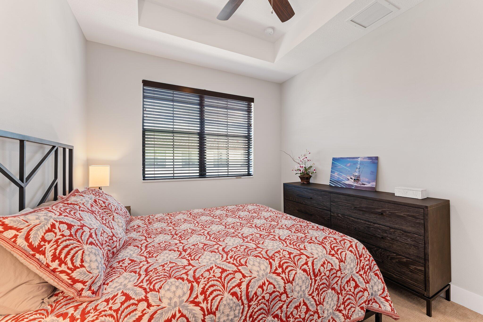 13364 Alton Road Palm Beach Gardens, FL 33418 - Photo 41 of 58 a bedroom with a bed and a window