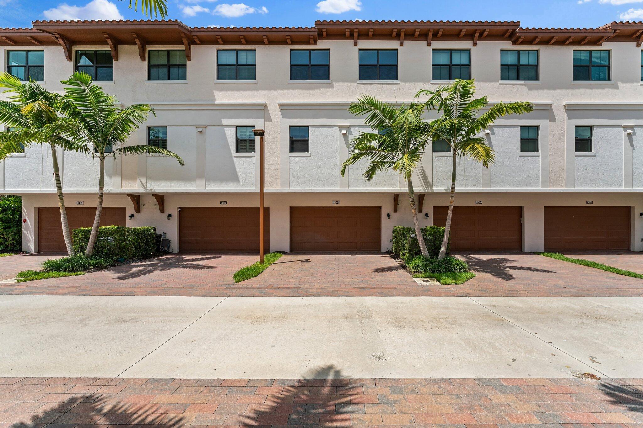 13364 Alton Road Palm Beach Gardens, FL 33418 - Photo 42 of 58 a house with palm tree in front of it