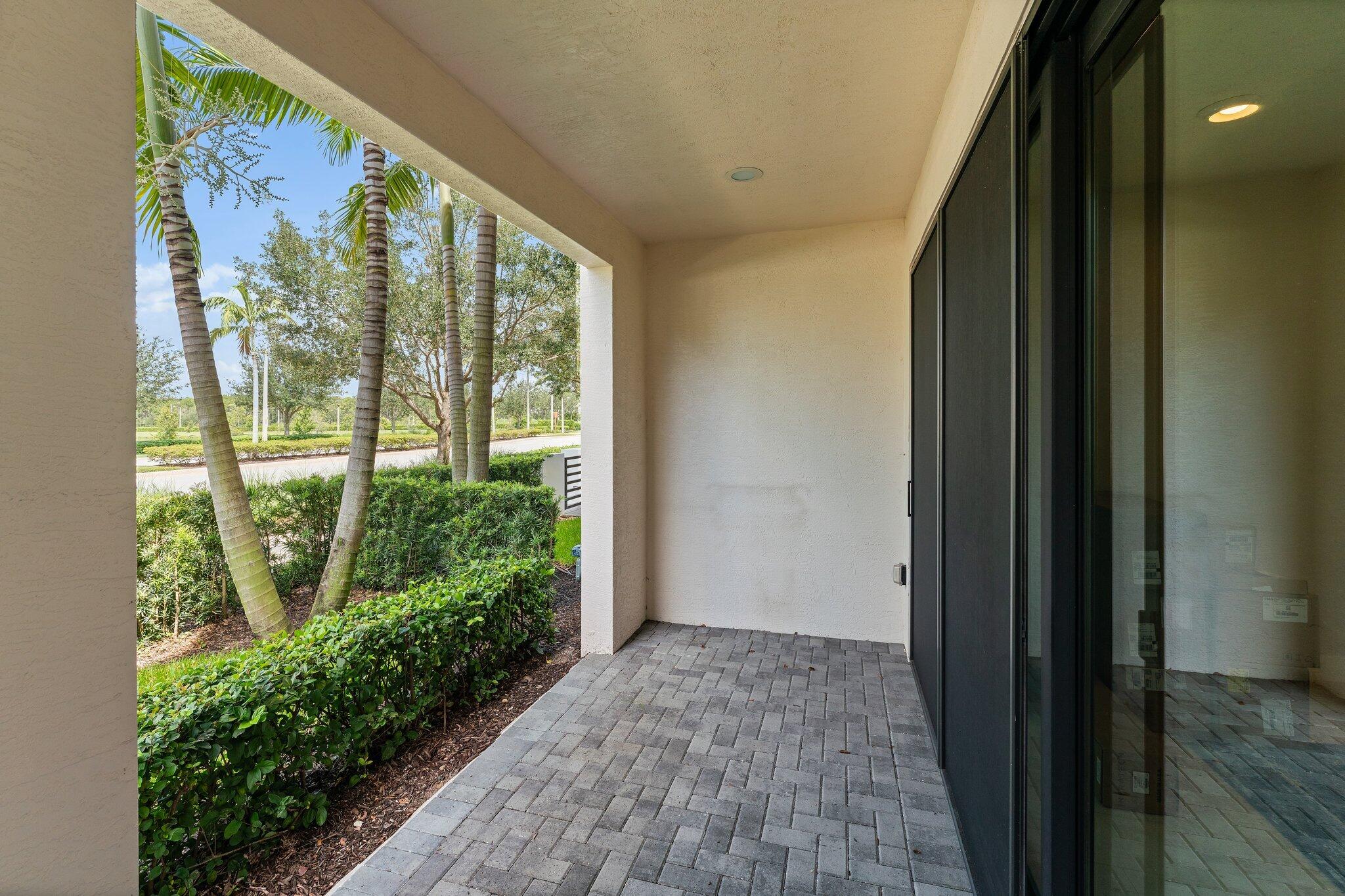 13364 Alton Road Palm Beach Gardens, FL 33418 - Photo 5 of 58 a view of a garden from a window