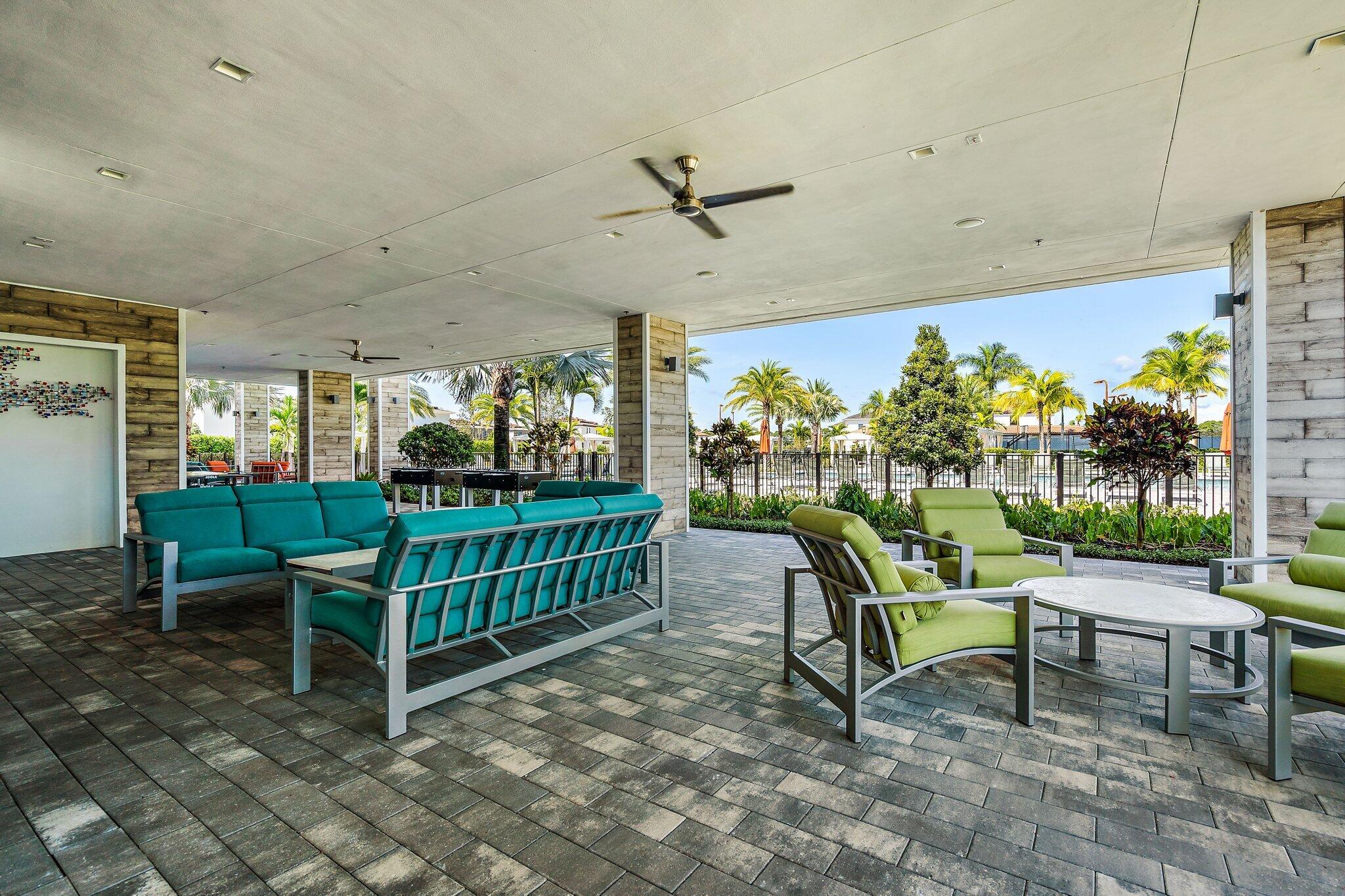 13364 Alton Road Palm Beach Gardens, FL 33418 - Photo 58 of 58 a view of a porch with chairs and a yard