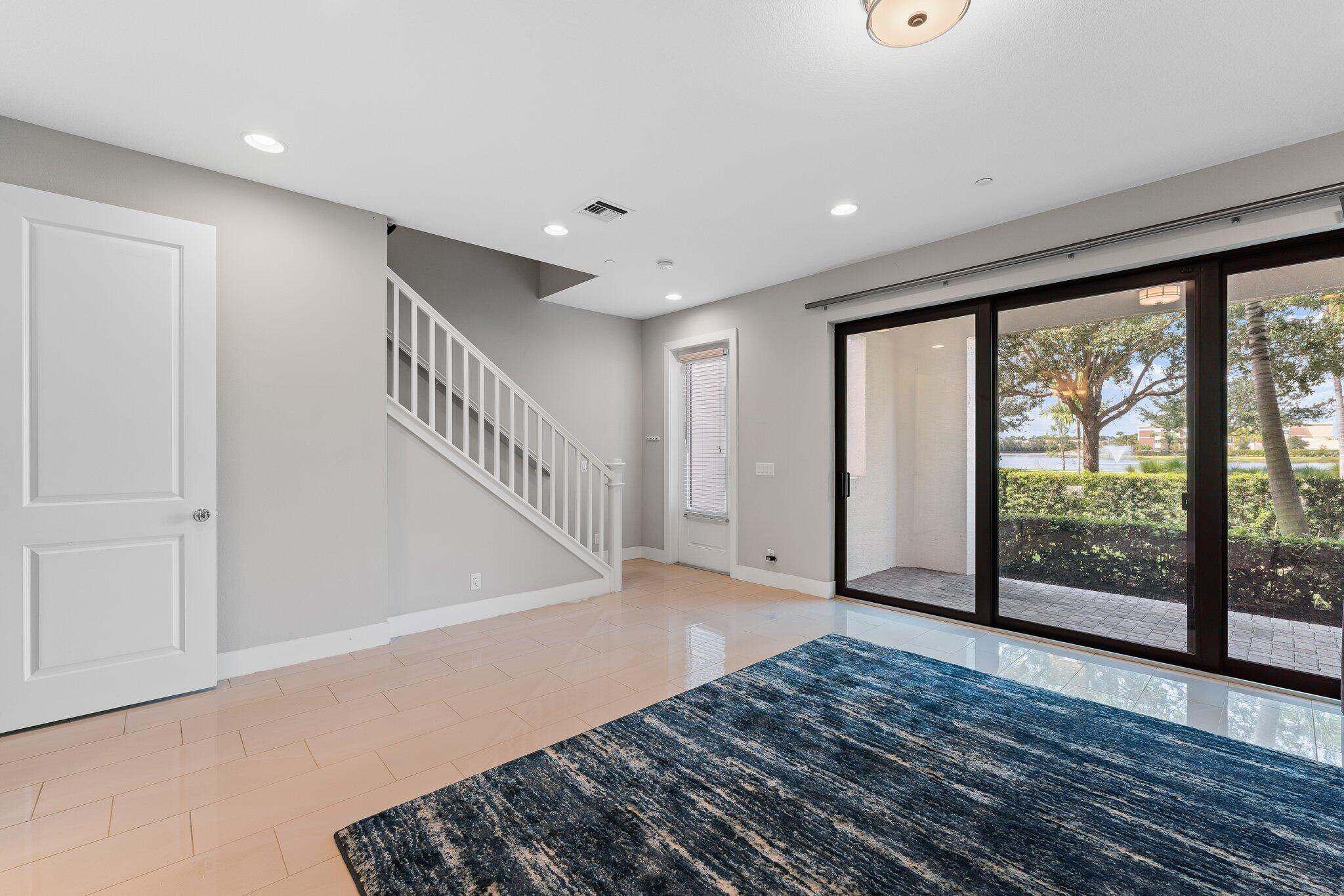 13364 Alton Road Palm Beach Gardens, FL 33418 - Photo 7 of 58 a view of entryway with wooden floor