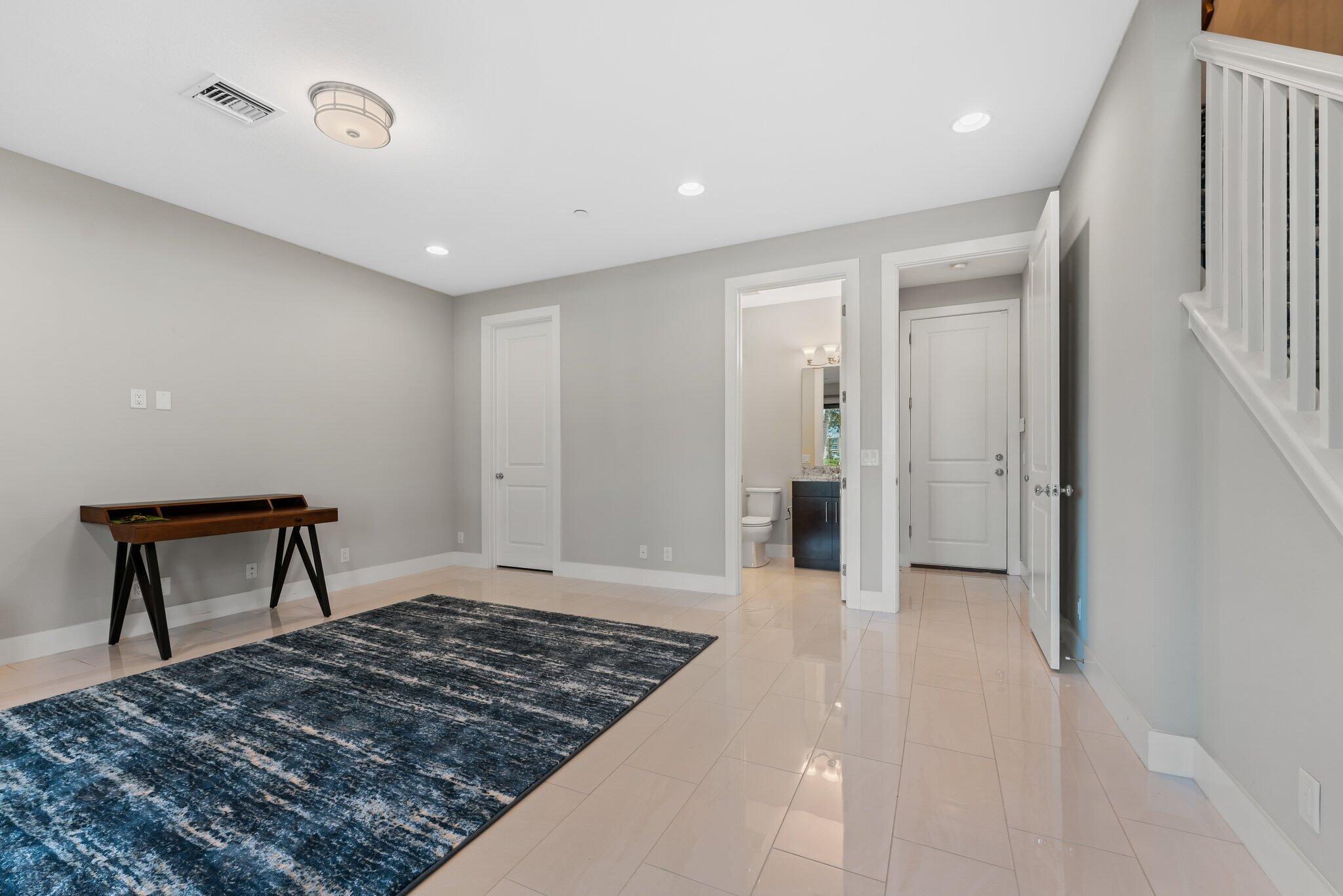 13364 Alton Road Palm Beach Gardens, FL 33418 - Photo 9 of 58 a bedroom with a bed and a table