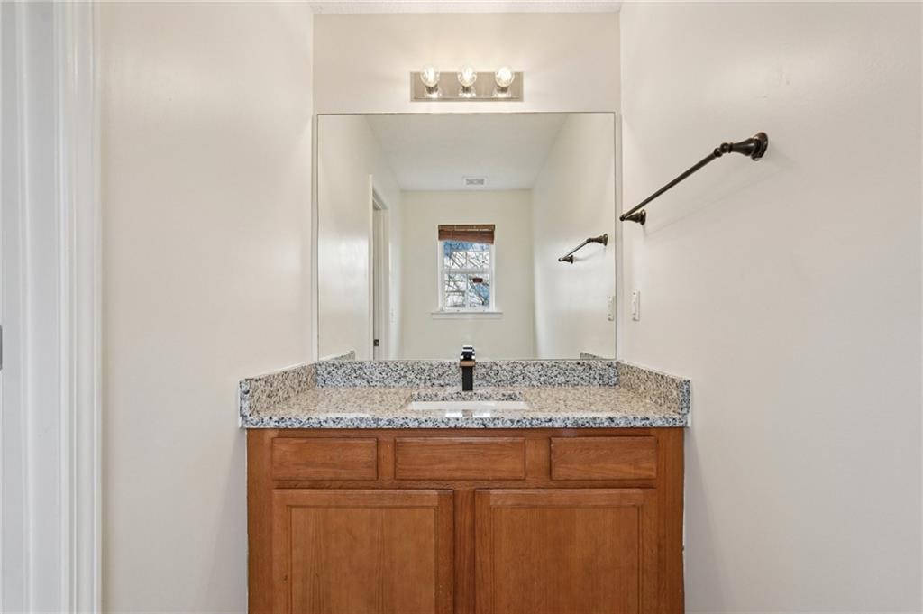 38 Middleton Court Cartersville, GA 30120 - Photo 22 of 46 a bathroom with a granite countertop sink and a mirror