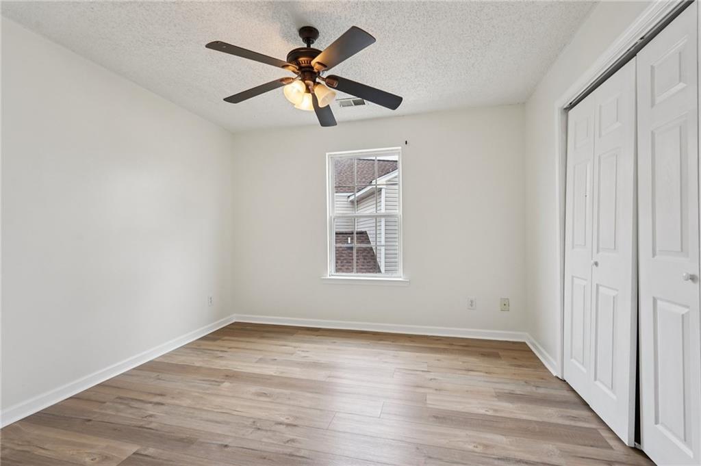 38 Middleton Court Cartersville, GA 30120 - Photo 29 of 46 an empty room with wooden floor and windows