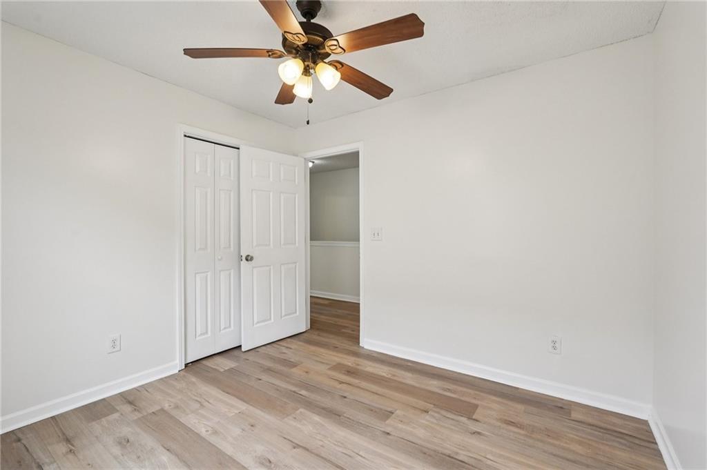 38 Middleton Court Cartersville, GA 30120 - Photo 33 of 46 an empty room with wooden floor fan and a ceiling fan