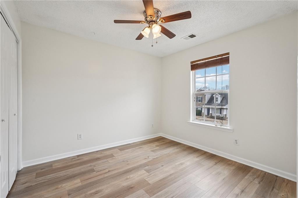 38 Middleton Court Cartersville, GA 30120 - Photo 34 of 46 wooden floor in an empty room with a window
