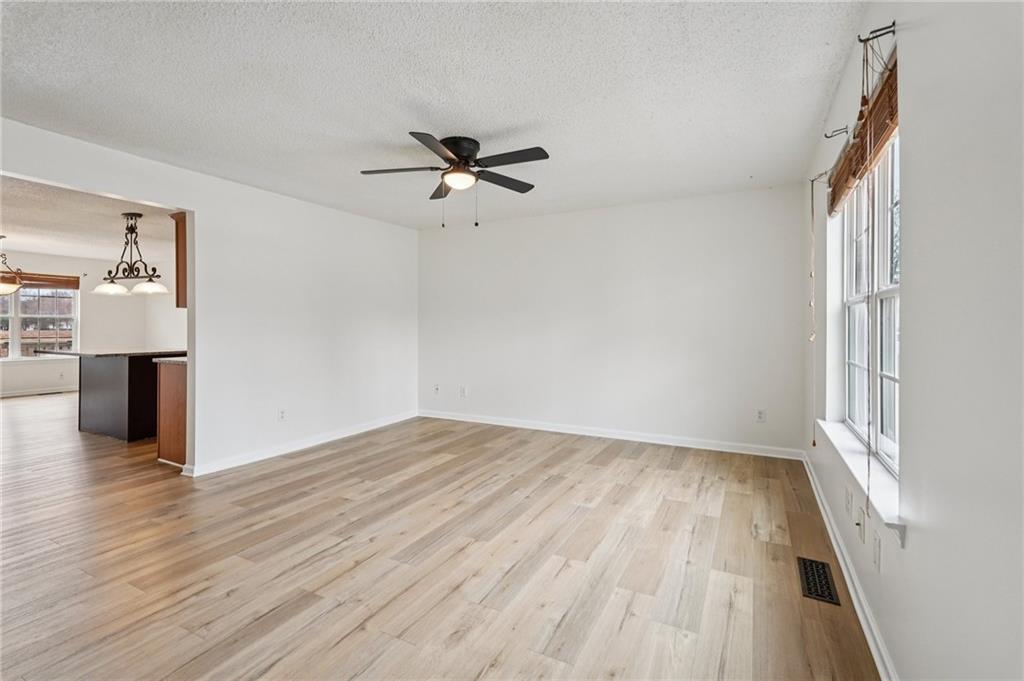 38 Middleton Court Cartersville, GA 30120 - Photo 5 of 46 wooden floor in an empty room with a window