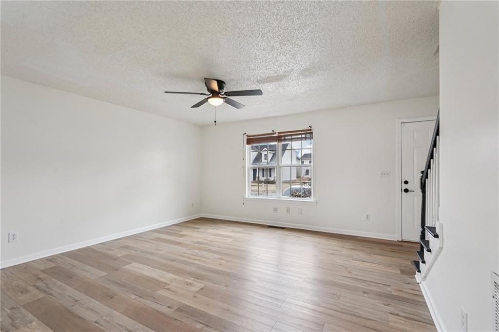 38 Middleton Court Cartersville, GA 30120 - Photo 6 of 46 wooden floor in an empty room with a window