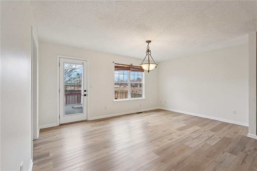 38 Middleton Court Cartersville, GA 30120 - Photo 10 of 46 wooden floor in an empty room with a window