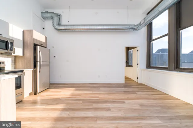 a view of an empty room with a window