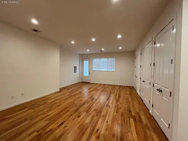 a white toilet sitting next to a shower