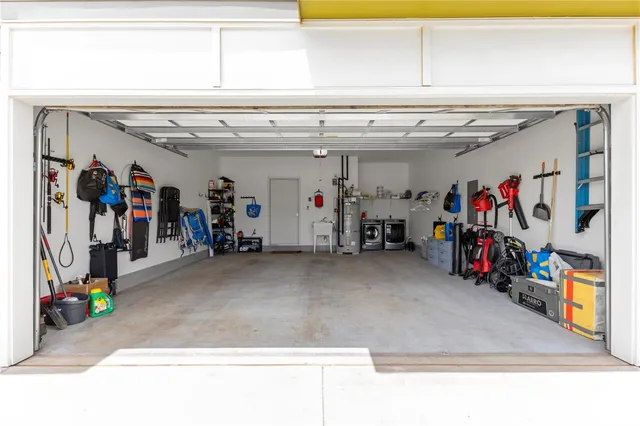a view of a lake with houses in the back